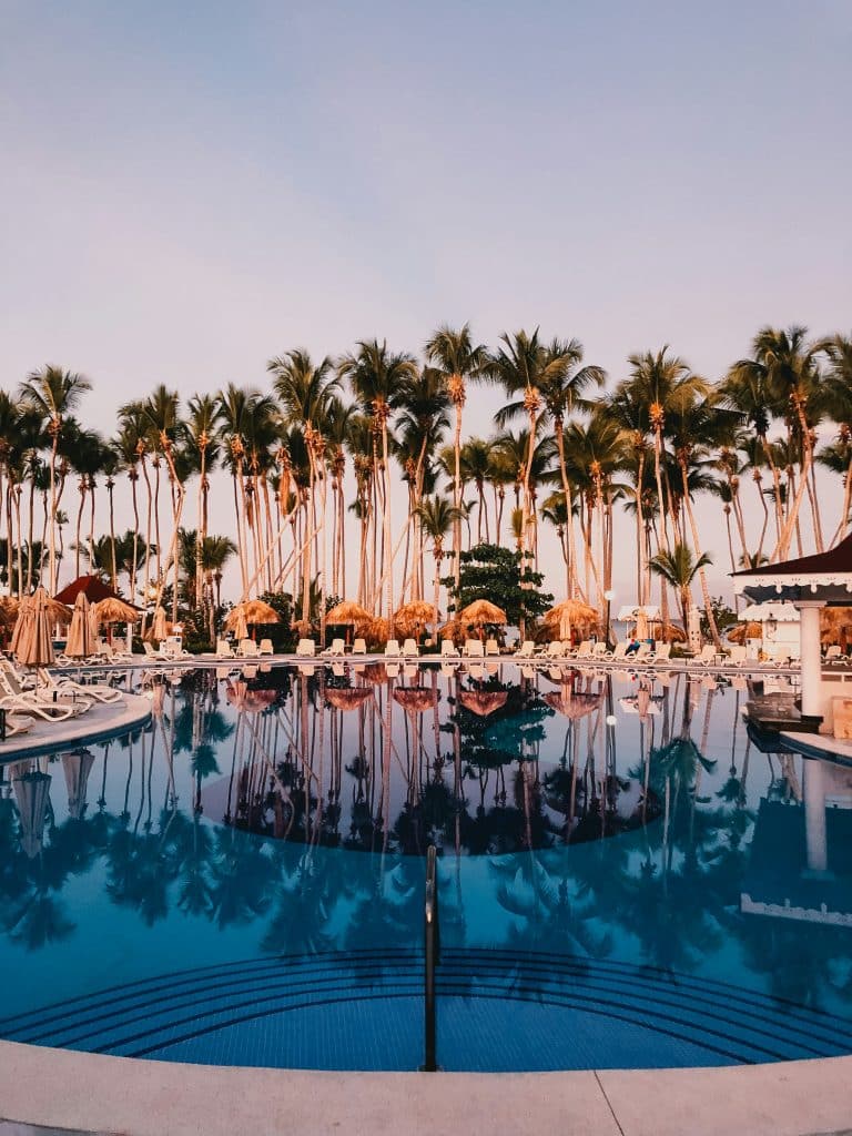 Hotel pool and palm trees in Dominican Republic
