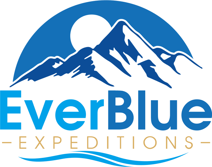 Logo for EverBlue Expeditions featuring stylized blue mountains with a sun or moon behind them. "EverBlue" is written in large blue and gold letters, with "Expeditions" and a wavy line below.