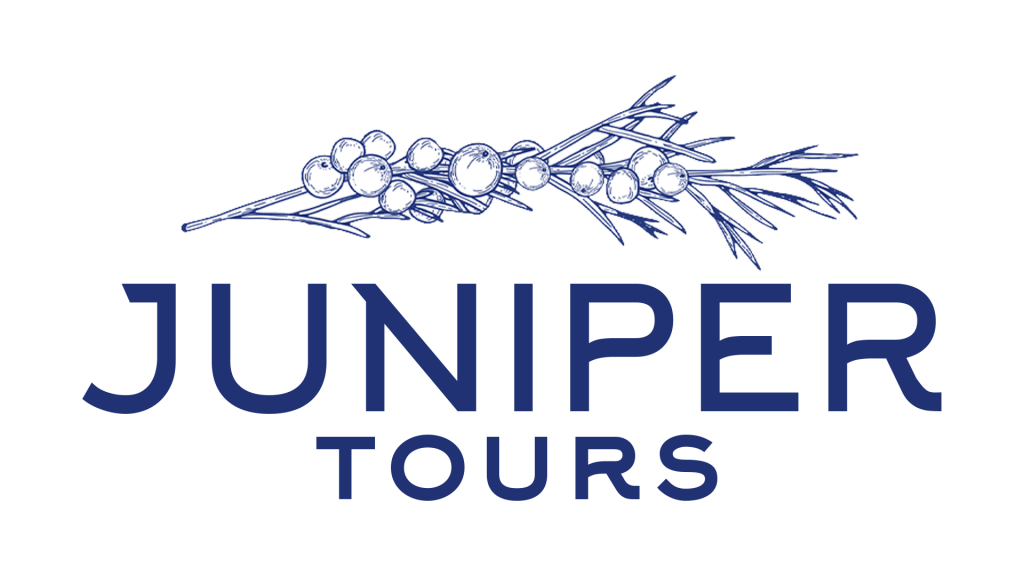 A stylized drawing of a juniper branch with berries appears above the bold text "JUNIPER TOURS" on a light background, evoking the adventure and spirit found in Go Blue Tours experiences.